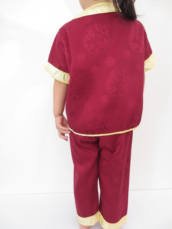 Kinderpak met draak d.rood