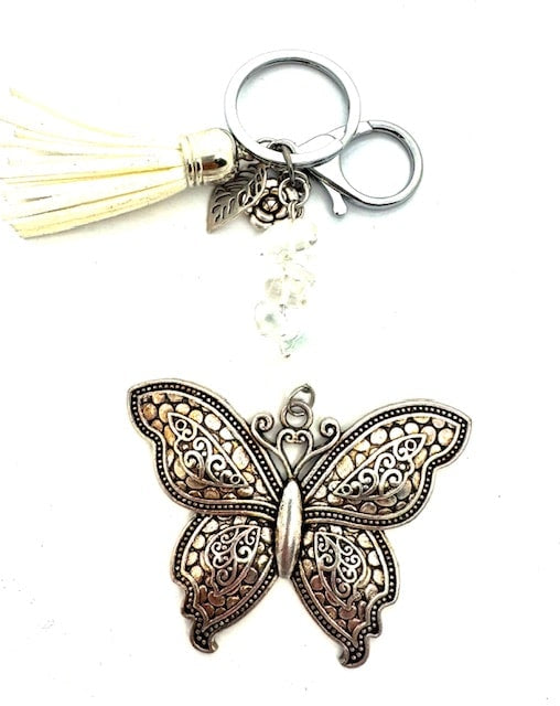 Groothandel vlinder sleutelhanger met howlietstenen en witte kwast