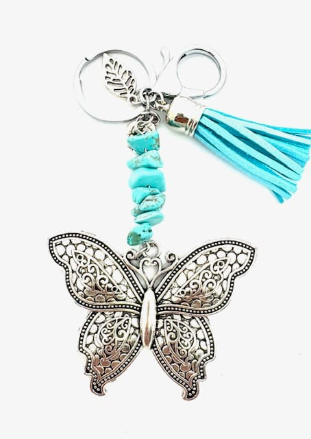 Groothandel vlinder sleutelhanger met turquoise stenen en turquoise kwastje